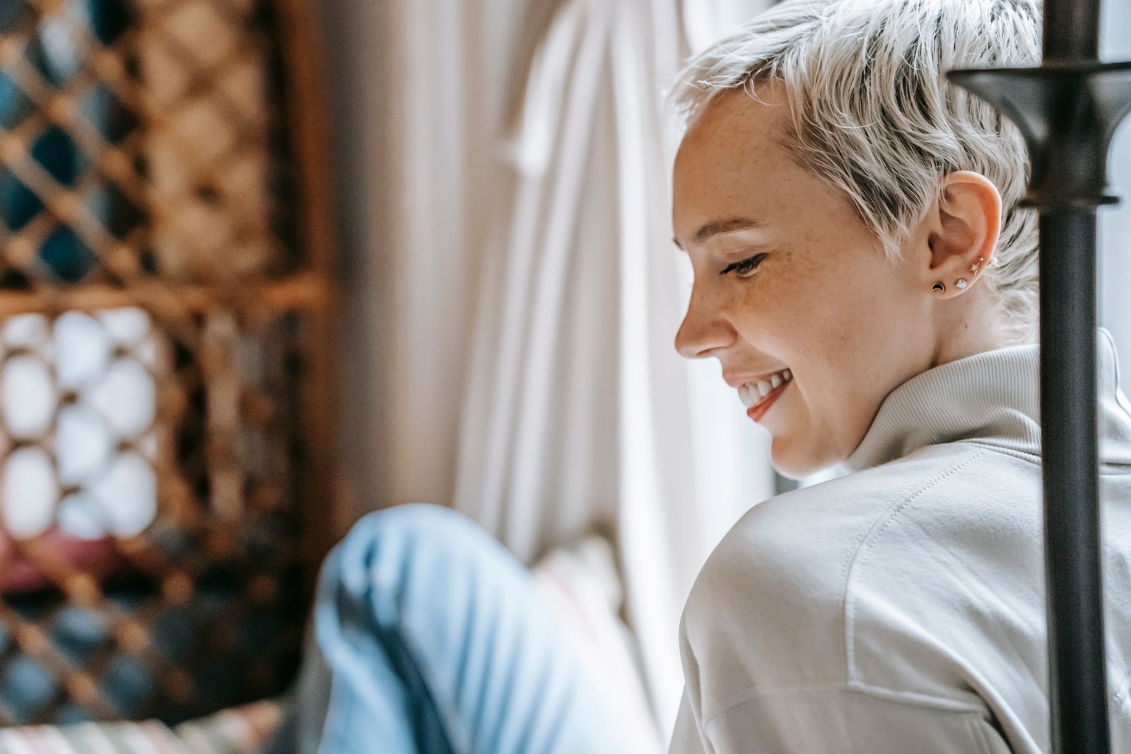 Woman smiling, relieved after sorting out her own health coverage