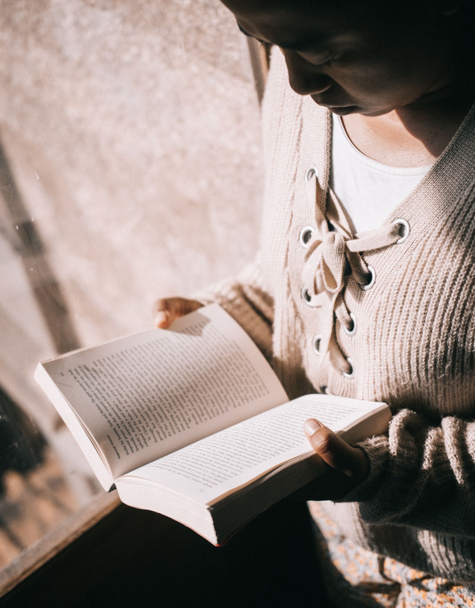 Person reading closely, focused on the details of a document