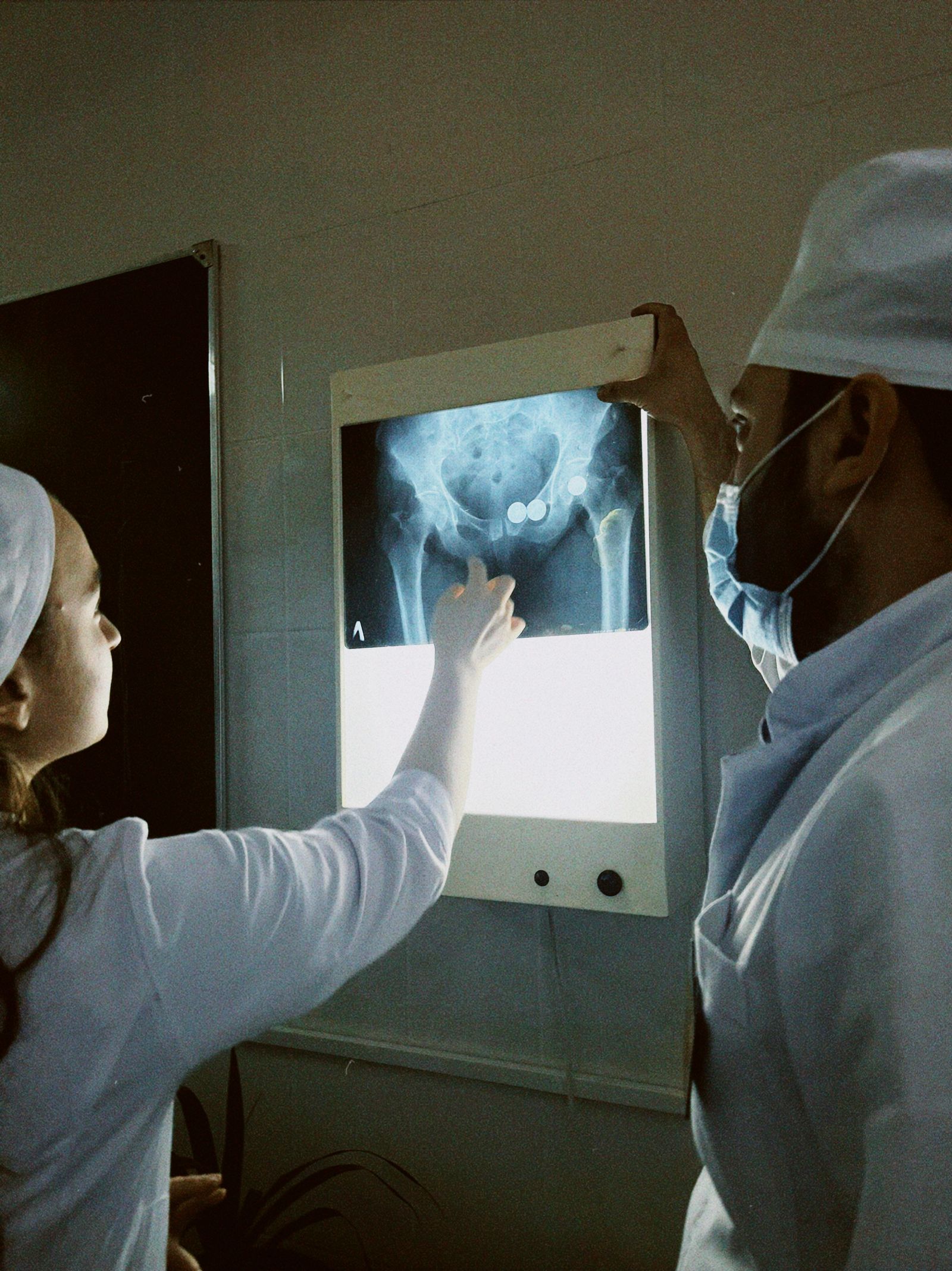 Clinicians reviewing a patient's medical imaging together