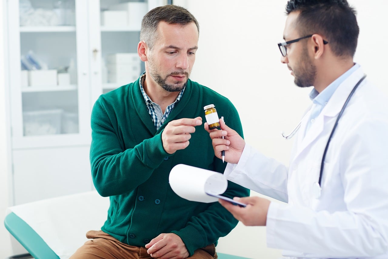 A friendly doctor talking with a patient during a routine checkup