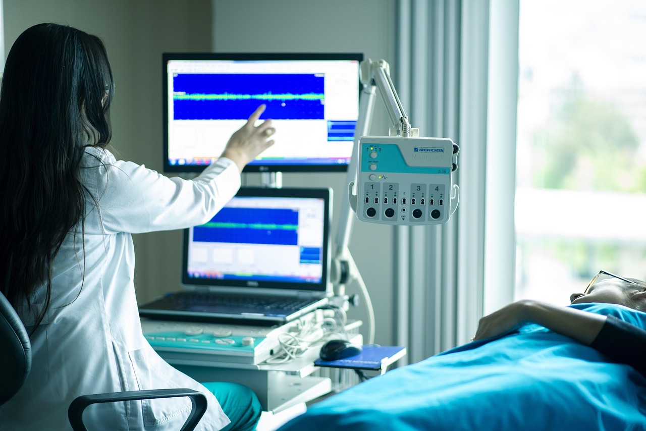 A friendly doctor talking with a patient in a bright exam room